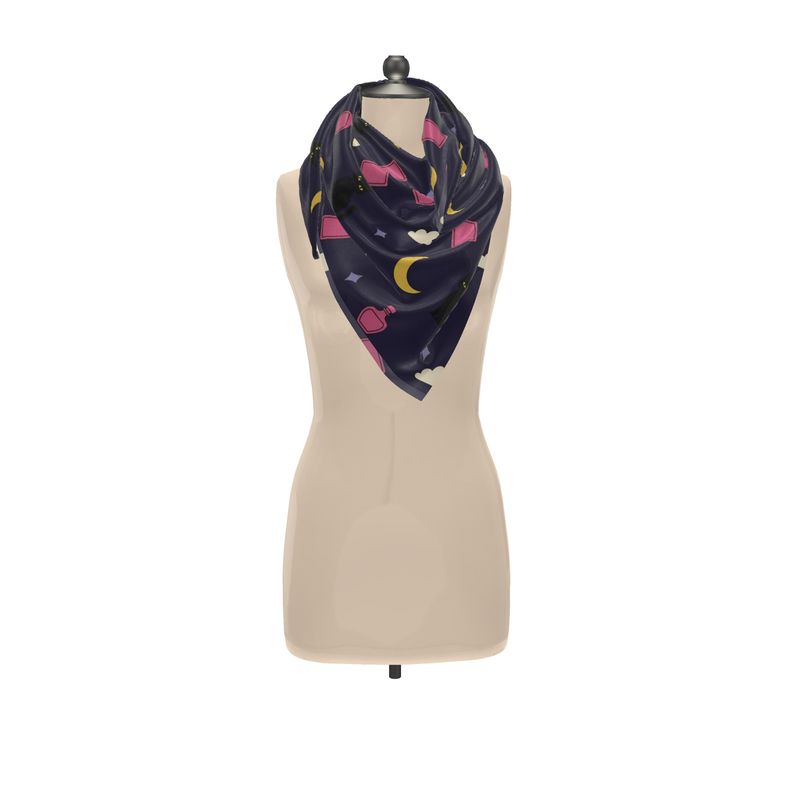 Navy blue scarf with colorful patterns on a mannequin against a white background